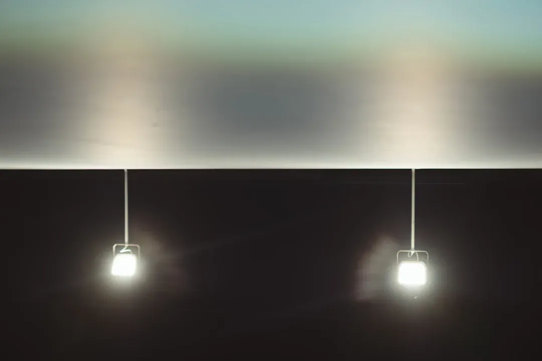 Male face comparison showing harsh overhead lighting versus soft front-facing light demonstrating looksmaxxing lighting techn